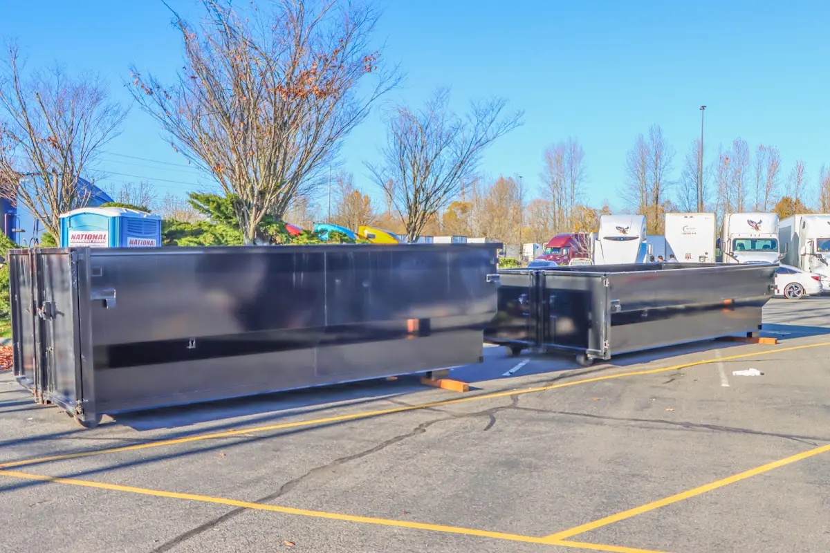 Professional dumpster rental service with roll-off container on residential driveway in Cutler Bay